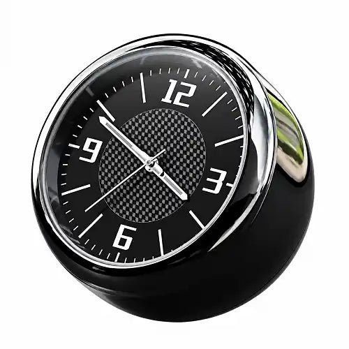 Mini round car dashboard clock featuring a black dial with a carbon fiber textured center, crisp white numerals, and a polished chrome rim, designed as a sleek automotive interior accessory.