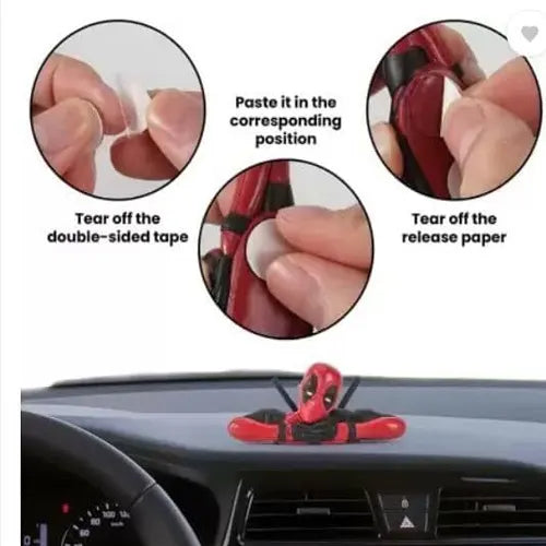 Installation guide for the Deadpool dashboard toy, demonstrating a three-step process: tearing off the double-sided tape, pasting it in the corresponding position on the figure, and removing the release paper for secure car mounting.