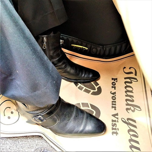 disposable paper floor mat placed inside car protecting original carpet during service | Carokit