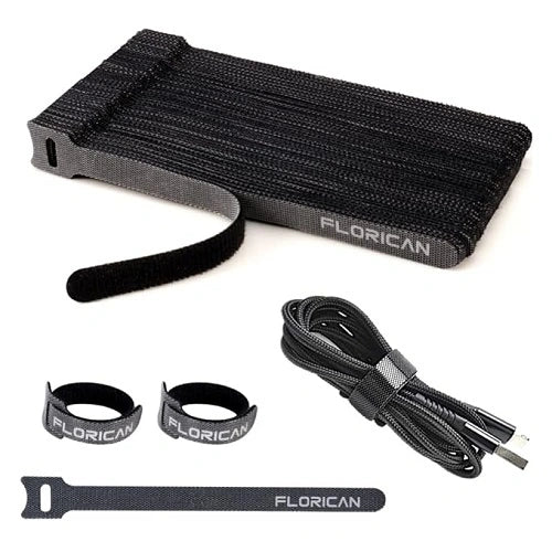 A bundle set of black Florican cable management straps, featuring a neat stack of ties, individually rolled straps, and a braided USB cord securely wrapped by a fastening tie.
