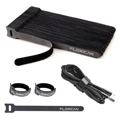 A bundle set of black Florican cable management straps, featuring a neat stack of ties, individually rolled straps, and a braided USB cord securely wrapped by a fastening tie.