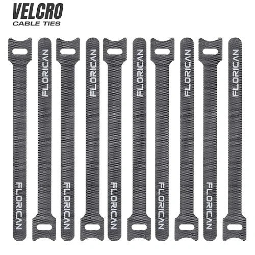 Ten black Florican branded velcro cable ties laid out vertically side-by-side, showcasing the multipack design ideal for comprehensive electronic wire organization.