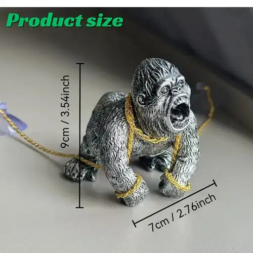 Product size and dimensions of the silver gorilla dashboard figure, indicating it measures 9 centimeters (3.54 inches) tall and 7 centimeters (2.76 inches) wide.
