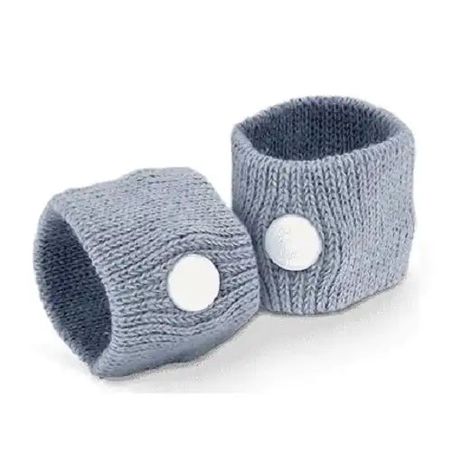 A pack of 2 grey knit motion sickness acupressure bands standing upright, highlighting the integrated white plastic buttons that apply targeted pressure to the wrist for natural nausea relief.