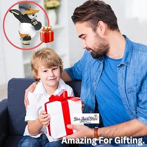 A father handing a wrapped gift to his smiling son, highlighting the Kung Fu Panda car accessory as an amazing and unique gifting option for kids, fans, and car enthusiasts.