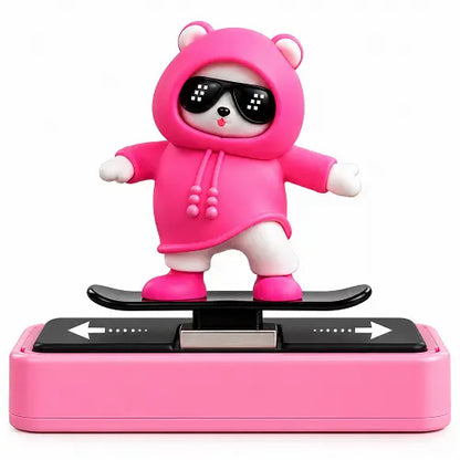 Cute 3D white bear wearing a bright pink hoodie and pixelated sunglasses, riding a black skateboard. The figure is mounted on a pink and black interactive sliding base, designed as a kawaii car dashboard ornament or desk accessory.