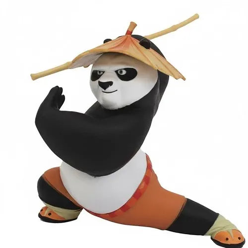 Clean front view of the Po panda car dashboard decoration toy standing in a wide, ready martial arts stance with a bamboo staff positioned behind its head.