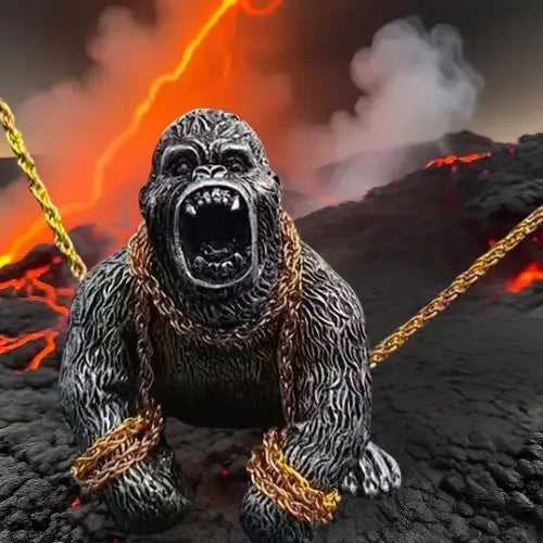 A roaring silver silverback gorilla auto interior decoration figure wrapped in gold chains, set against a dramatic, fiery volcano background.