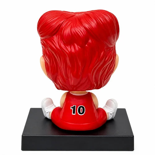 Back view of the Hanamichi Sakuragi dashboard bobblehead toy, showing the detailed sculpting of his red hair and the number 10 printed on the back of his basketball jersey.