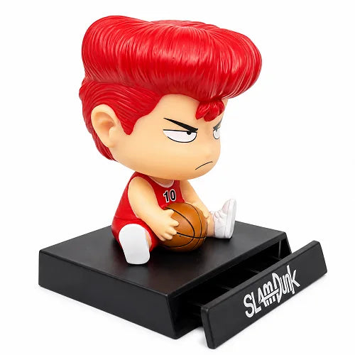 Side view of the Slam Dunk anime car ornament, highlighting the functional black base that features a pull-out drawer designed to act as a hidden mobile phone stand for your vehicle.
