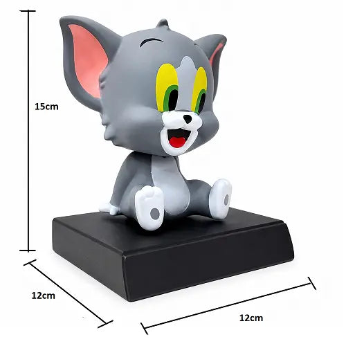 Dimensions of the Tom car dashboard bobblehead and phone mount, measuring 15 centimeters tall and 12 centimeters wide and deep on the base.