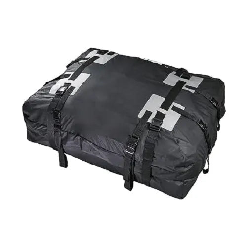 A fully packed and zipped Velura waterproof car roof luggage storage bag resting on a white background, highlighting its heavy-duty tie-down straps, secure buckles, and silver reflective safety patches.